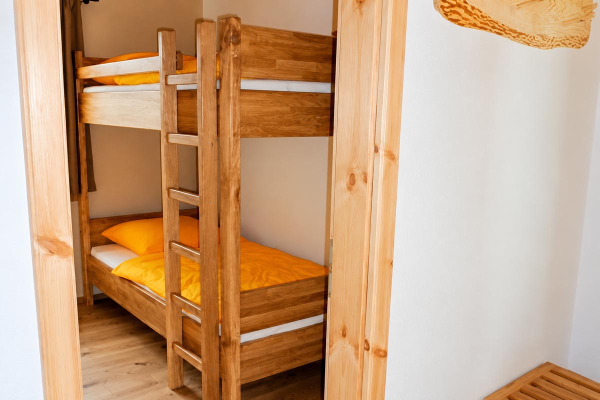 Ferienwohnung Winterstein – Schlafzimmer Ferienhaus Winterbergblick in Hinterhermsdorf - Ferienwohnung Winterstein - Schlafzimmer mit Dopppelstockbett